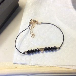 BLACK AND Gold Bracelet with Lobster claw Clasp NWOT about 8 inches long